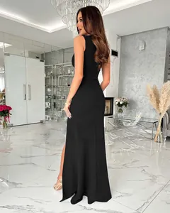 Detail of the elegant side slit on a black sleeveless slim fit formal maxi dress