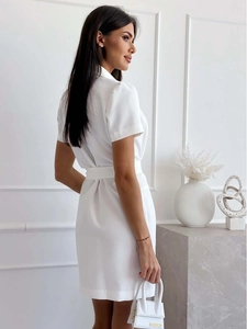 Detail of white short sleeve blazer dress with waist belt and a mini handbag