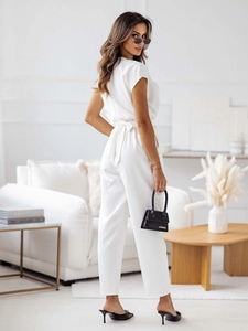 Detail view of a white V-neck short sleeve jumpsuit with a matching waist tie belt