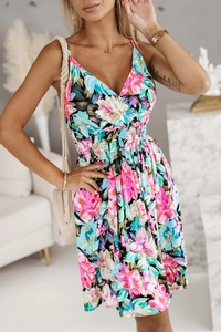 Detailed view of the V-neckline and vibrant floral print on the summer sundress fabric