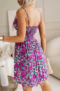 Detail of smocking elastic back and floral print on a summer V-neck midi dress