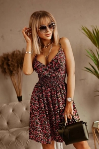 Detailed close-up of V-neck floral summer dress with vintage pattern and elastic waist