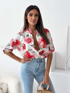 Detailed view of floral print shirt with stand collar and single-breasted button closure