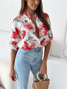Detail of floral printed white shirt with red peony pattern and rolled-up five-point sleeves