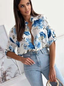 Close-up of floral print blouse with blue flower patterns and single-breasted detail