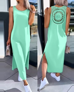 Detail of mint green sleeveless dress showing back circular crochet cutout and side slits