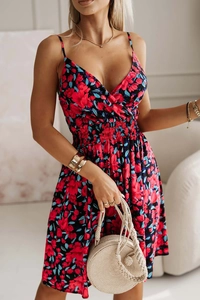 Close-up of floral print V-neck dress featuring smocked waist and soft chiffon fabric