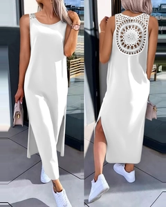 Detailed back view of white sleeveless maxi dress featuring intricate floral lace cut-out design