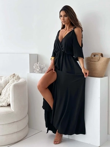 Detail of elegant black cold-shoulder maxi dress with V-neck and high side slit