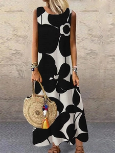 Detail of a casual sleeveless maxi dress featuring bold black and white floral print