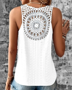 Detail of bohemian white sleeveless top showing intricate hollow mandala lace on the back