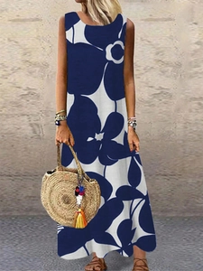 Detail of summer sleeveless maxi dress with navy blue abstract floral print and A-line cut