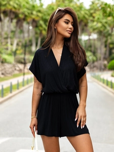 Detailed close-up of ribbed texture and V-neckline on a black summer romper outfit