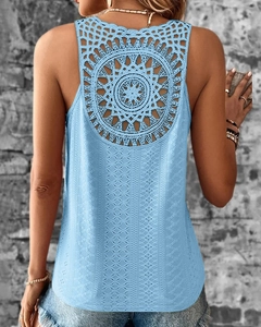 Detail of light blue sleeveless top featuring intricate hollow crochet back design