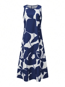 Detail of navy blue and white abstract floral print on a sleeveless A-line maxi dress