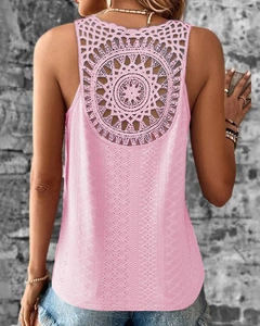 Close-up of bohemian hollow lace mandala design and floral jacquard on pink tank top