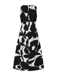 Detail view of the teardrop back opening on a black and white floral sleeveless dress