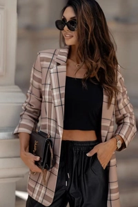 Detailed view of women's khaki plaid blazer with classic lapels and English urban style