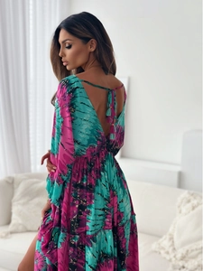 Detail of bohemian floral maxi dress featuring deep V back and tassel tie straps