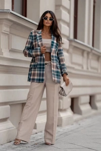 Three-piece set featuring a plaid blazer, beige bandeau top, and wide-leg trousers in a city style