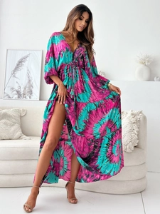 Detail of bohemian deep V-neck maxi dress with vibrant tie-dye print and side slit