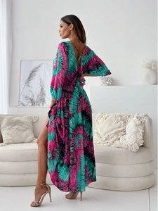 Detail view of bohemian V-neck floral maxi dress with high side slit and backless design