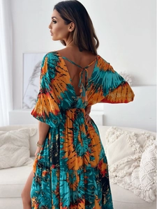 Detail of bohemian tie-dye dress featuring a backless design with adjustable lace-up ties
