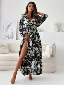 Detail view of abstract black and white floral print with high side slit on long dress