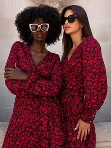 Outdoor street style view of V-neck floral wrap dress with long lantern sleeves