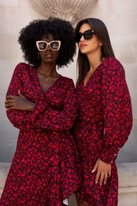 Detail of long sleeve V-neck wrap dress with abstract floral print and ruffle details