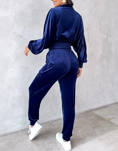 Rear view of women's dark blue velvet tracksuit with lantern sleeves and elastic waist