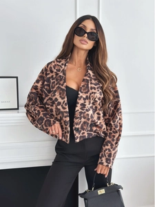 Detail of leopard print short blazer featuring lapel collar and stylish black buttons