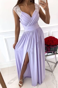 Detail of lavender v-neck dress with white lace shoulders and high slit skirt