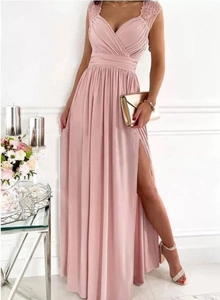 Detail of dusty pink sleeveless evening dress with lace straps and side slit