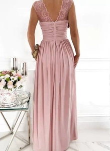 Detail of pink lace V-neck and open back design on a long flowing sleeveless dress