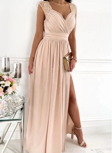 Detailed view of elegant sleeveless evening gown with high side slit and lace straps