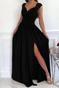 Detail of elegant black evening dress with lace neckline and high slit hemline