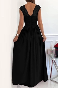 Detail of elegant backless dress featuring intricate black lace embroidery and a V-neckline