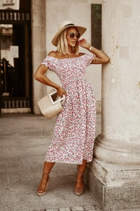 Macro detail of red floral off-the-shoulder summer dress with smocking and elastic waist