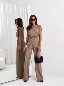 Detailed view of women's coffee brown sleeveless suit set with draped asymmetric waist