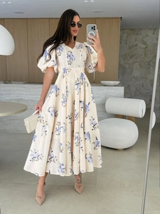 Detail of V-neck puff sleeve maxi dress with floral print and waist tie design