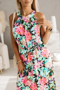Detail of tropical floral halter dress featuring a drawstring waist and sleeveless cut