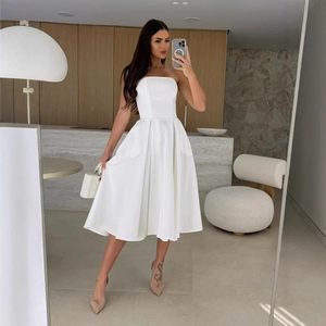 Elegant white strapless midi dress with a cinched waist and A-line pleated skirt