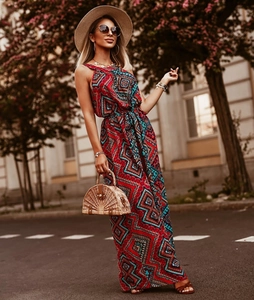Detail of bohemian floral maxi dress with halter neck and matching waist belt
