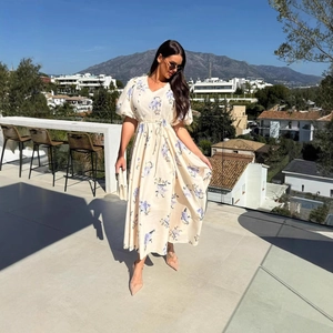 Floral V-neck puff sleeve maxi dress with drawstring waist and elegant flowy skirt