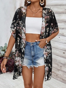 Close-up of lightweight black floral chiffon cardigan with pink flower patterns
