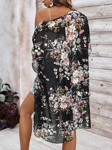 Detail of sheer floral chiffon kimono cover-up with delicate pink flower print on black fabric