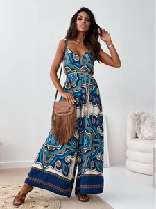 Detail of bohemian floral wide-leg jumpsuit with V-neckline and tassel waist belt