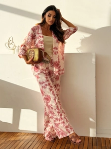 Detail of floral printed two-piece leisure set with wide-leg pants and matching shirt