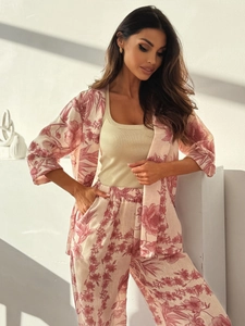 Close-up of cotton linen texture and vintage floral print on a women's two-piece set